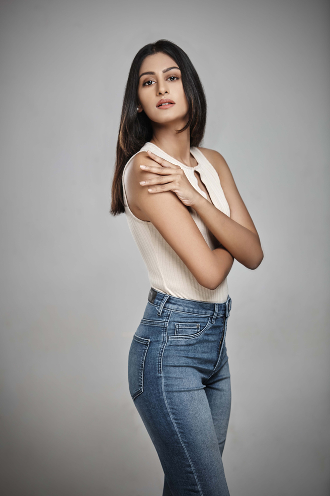 Bangalore based fashion model wearing a white top with blue denims