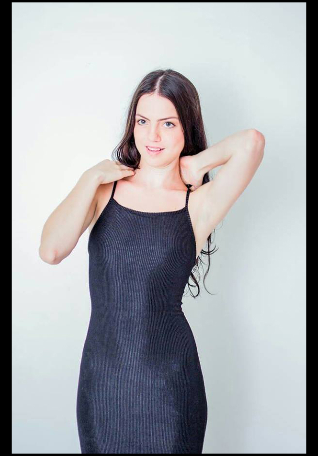 International fashion model Pmella Ivinin  in an elegant black dress