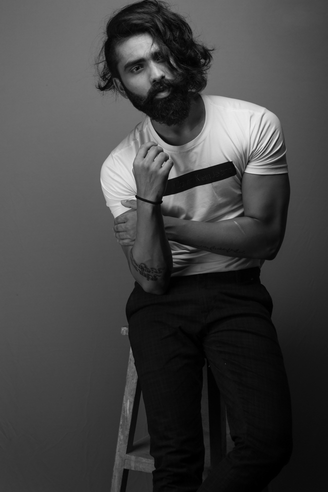 Black and white studio fashion photograph featuring Sagar Kava