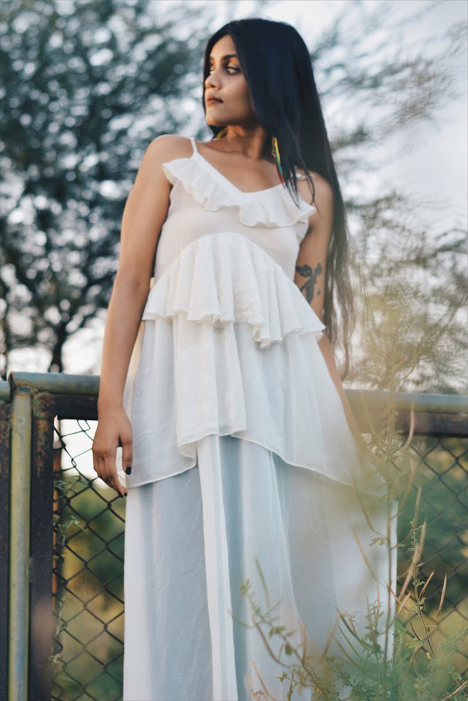 Modeling picture of fashion blogger Palak Singhal wearing a elegant white dress