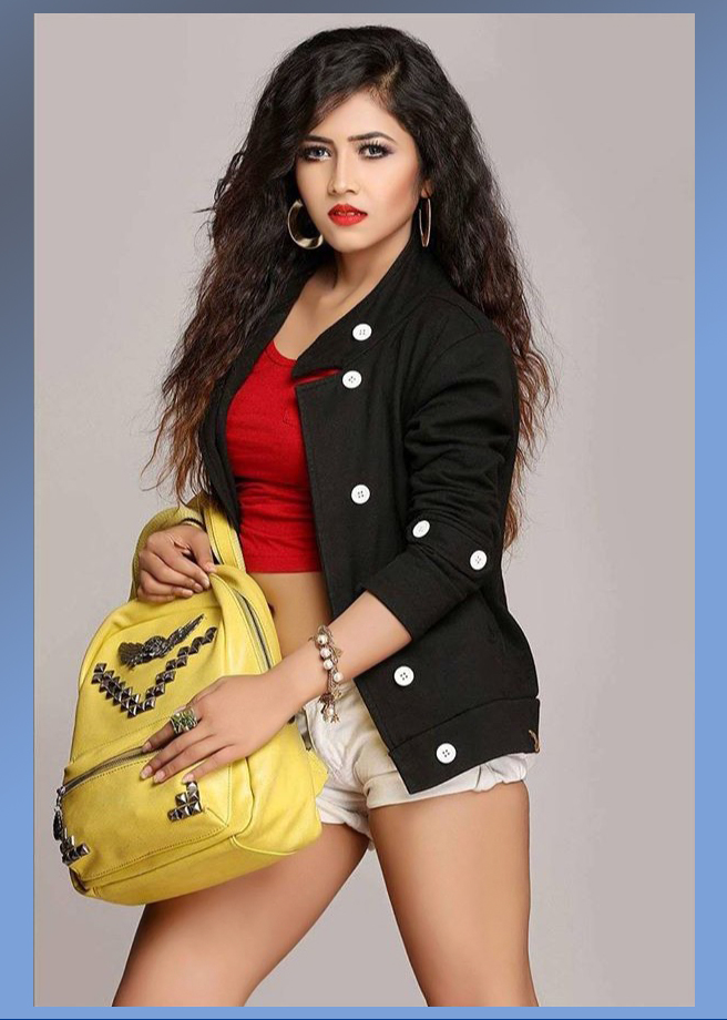 Stunning Guwathati based model Priya Chettri wearing denim shorts with a red top and a black jacket