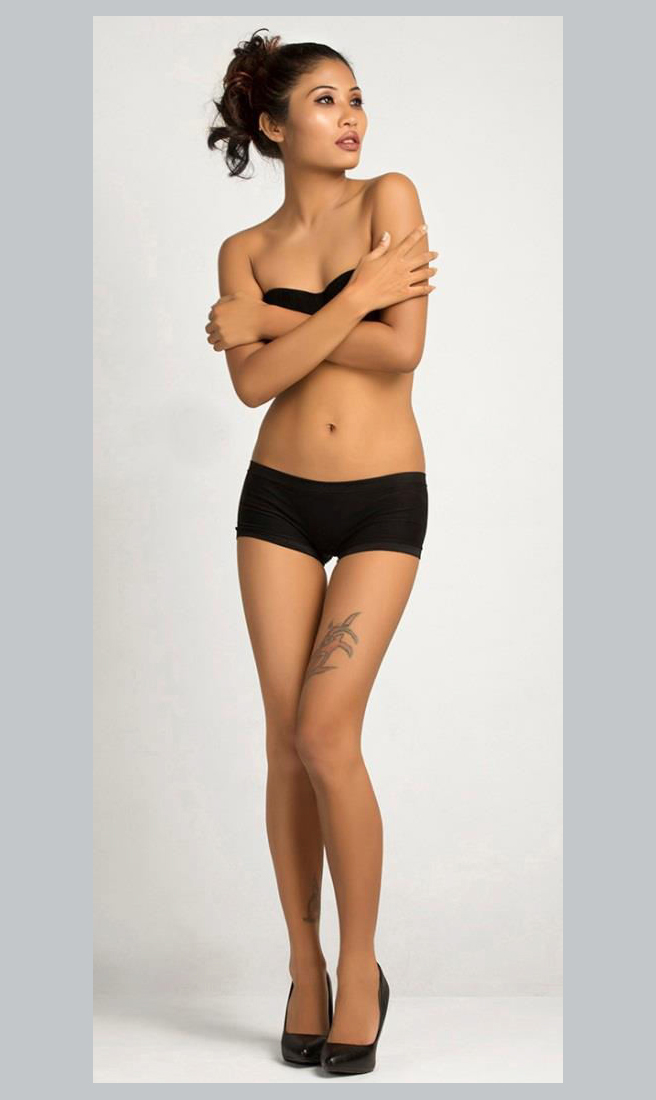 Indian Glamour model Varsha Das photographed in a black bikini and black heels